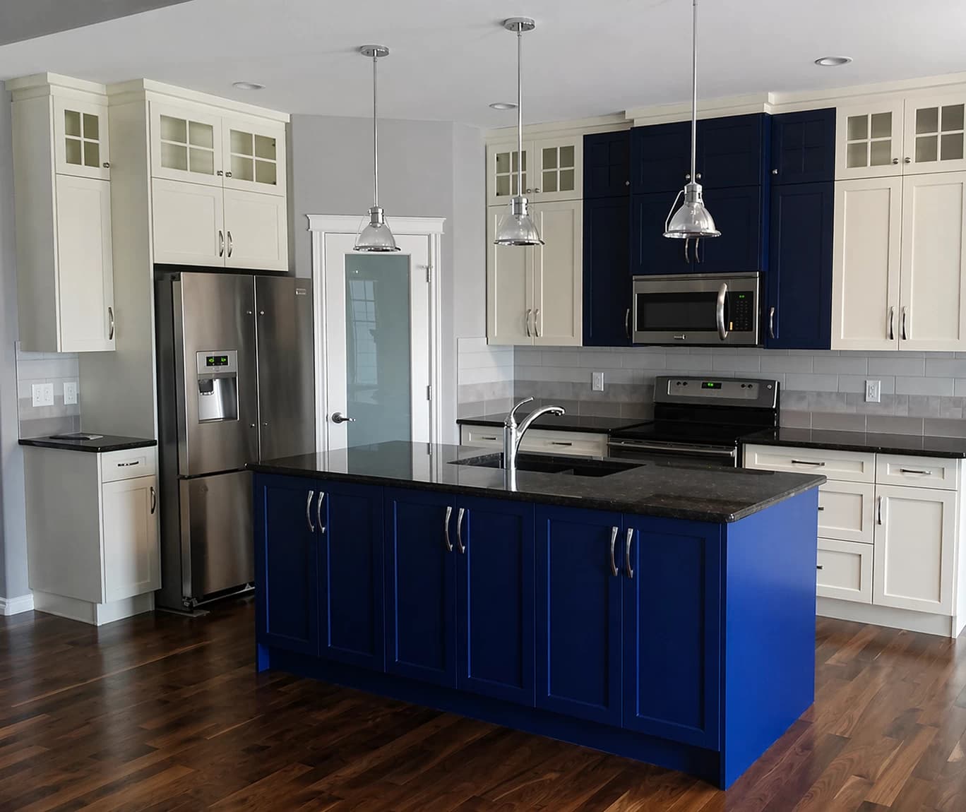 Cream kitchen with deep blue island