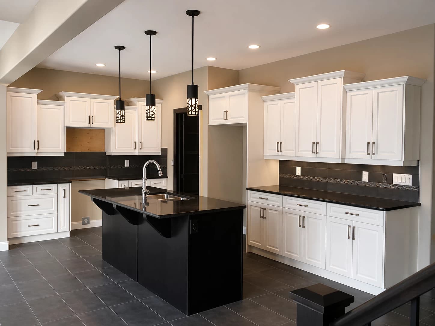 White uppers with black island contrast kitchen