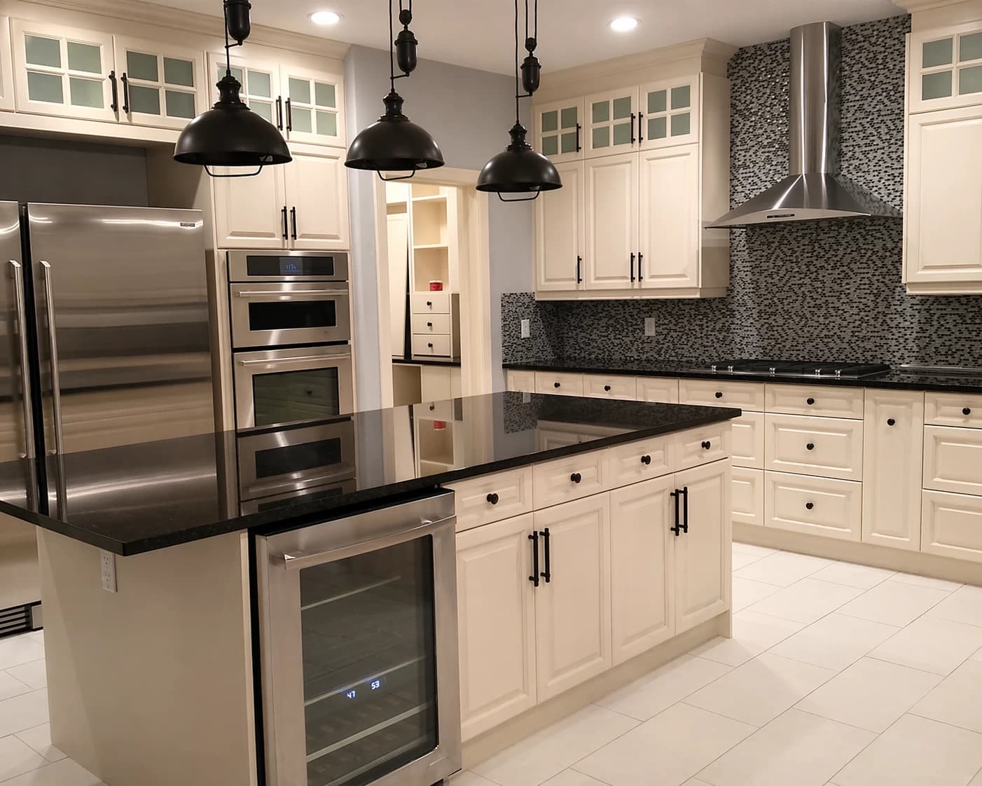 Cream traditional kitchen with wine fridge island