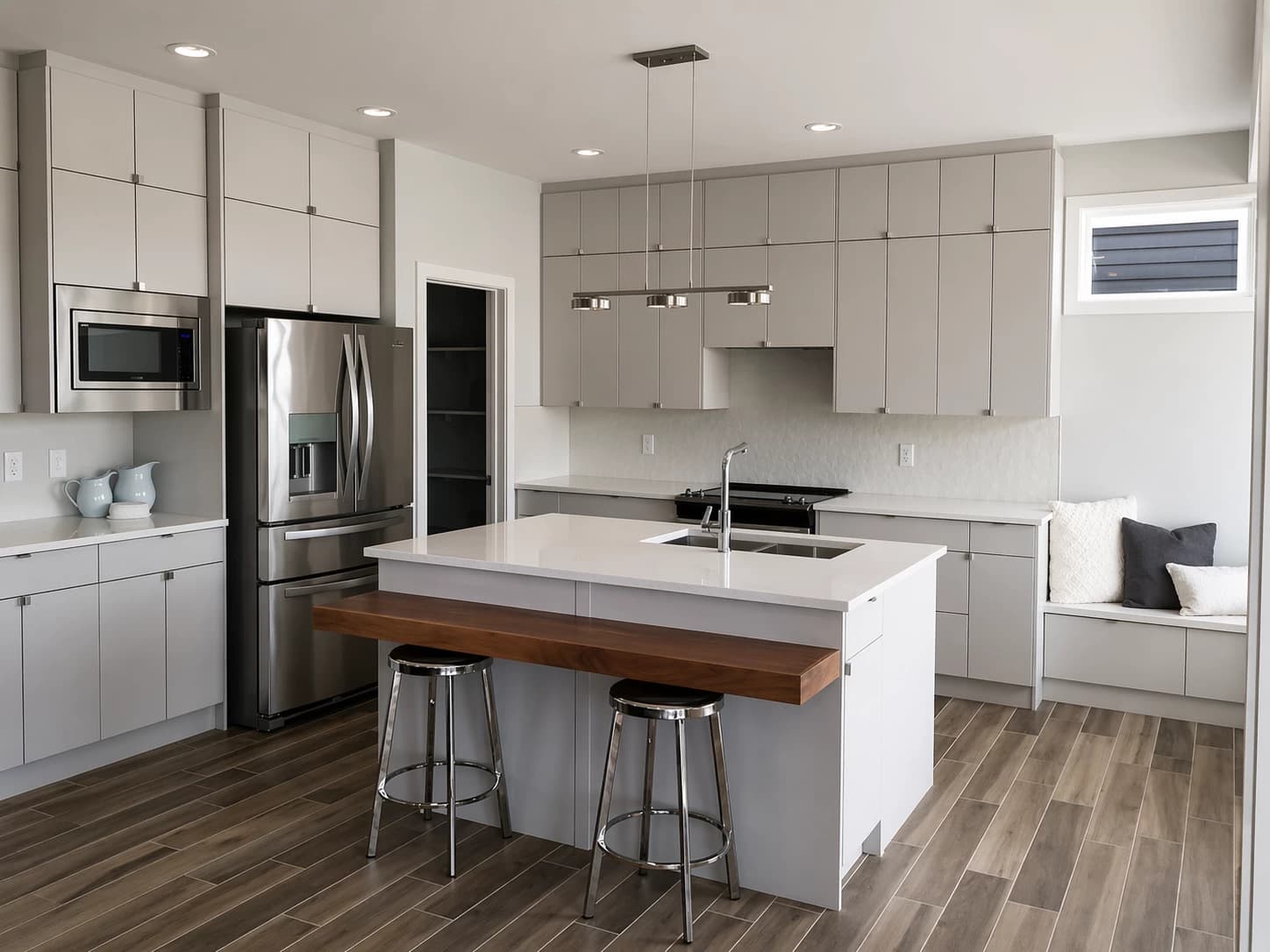 Grey modern kitchen with window bench seating