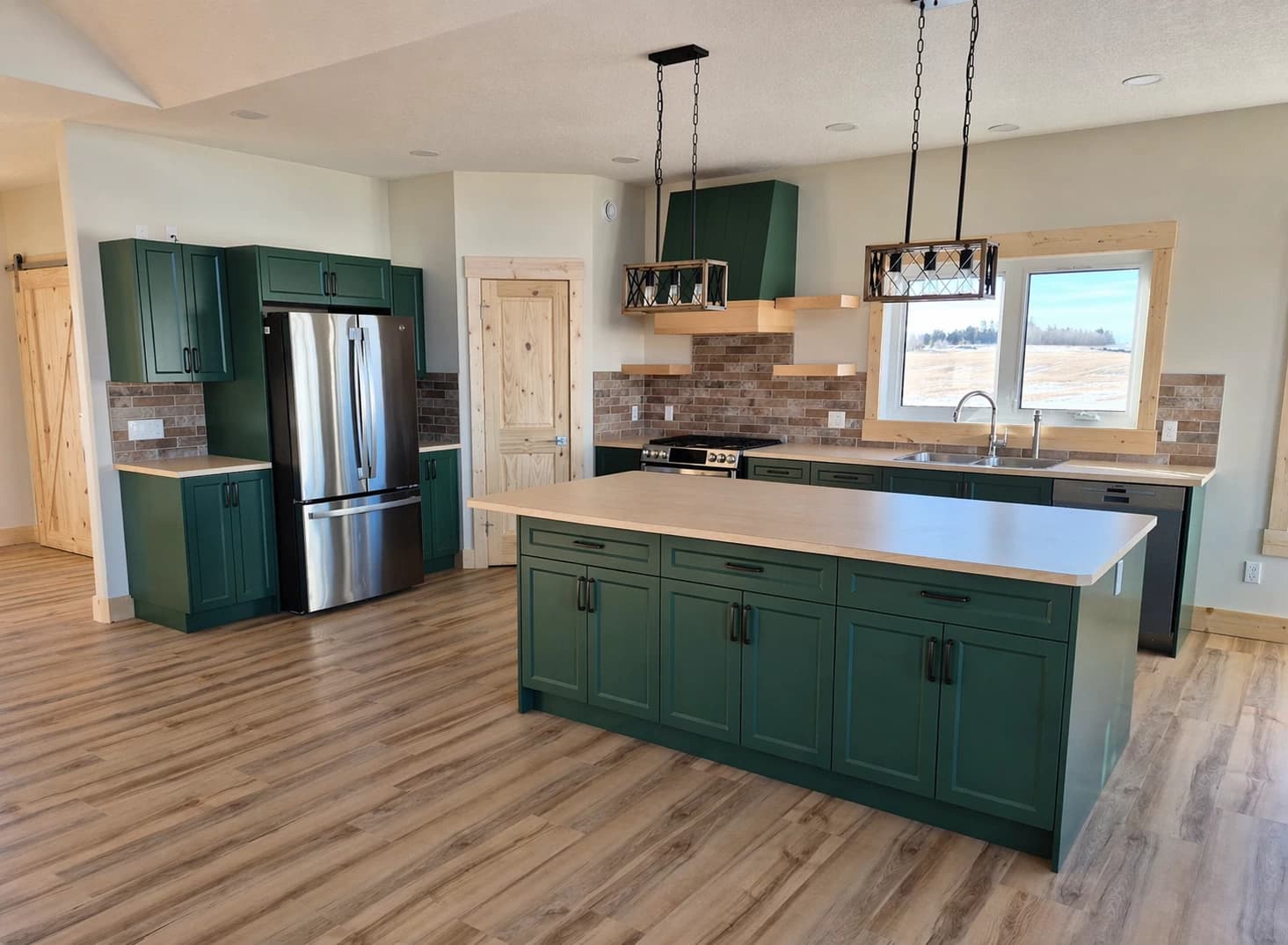 Green painted custom kitchen with floating shelves