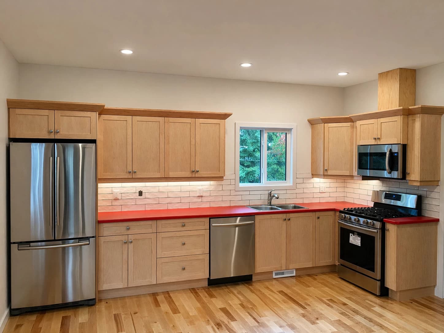 Maple shaker kitchen with red counter