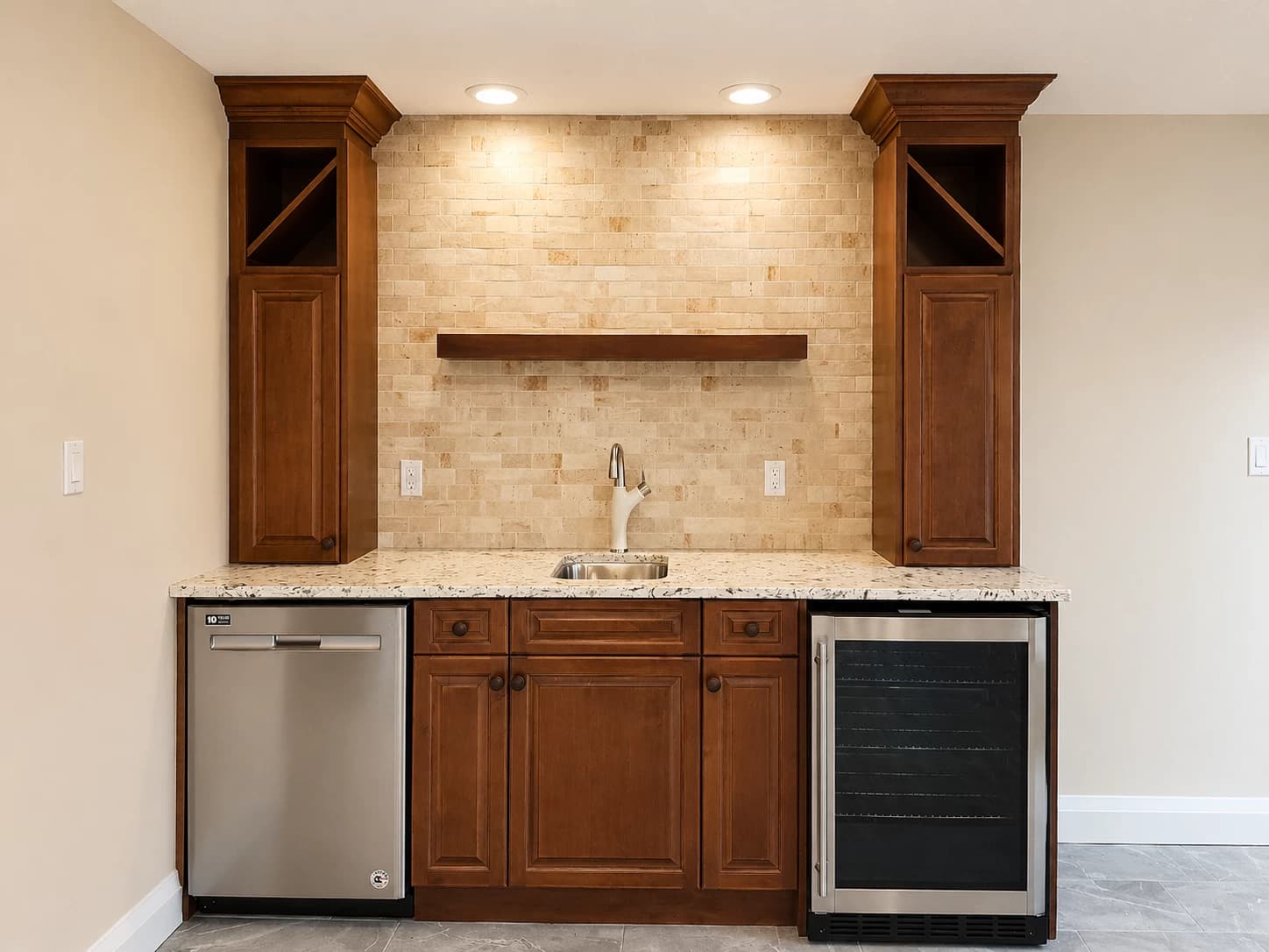 Traditional cherry wet bar with stacked stone backsplash and built-in beverage fridge