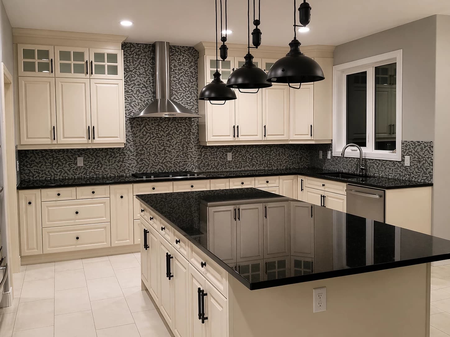 Cream traditional kitchen with black granite counters