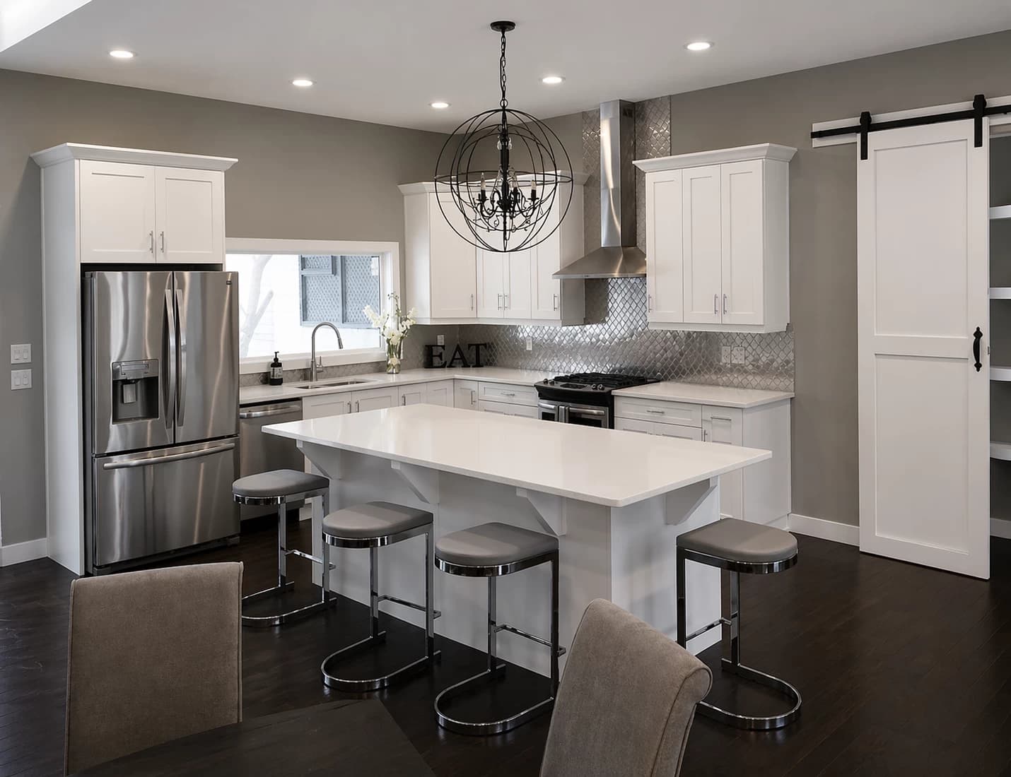 White modern custom kitchen with barn door